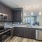 Open kitchen area hanging lights brightening the room