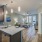 Open kitchen area next to an open living room and bedroom