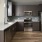 Kitchen Space with lots of open space in the middle, tall cabinets and stainless appliances