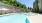 pool with lounge chairs and shade