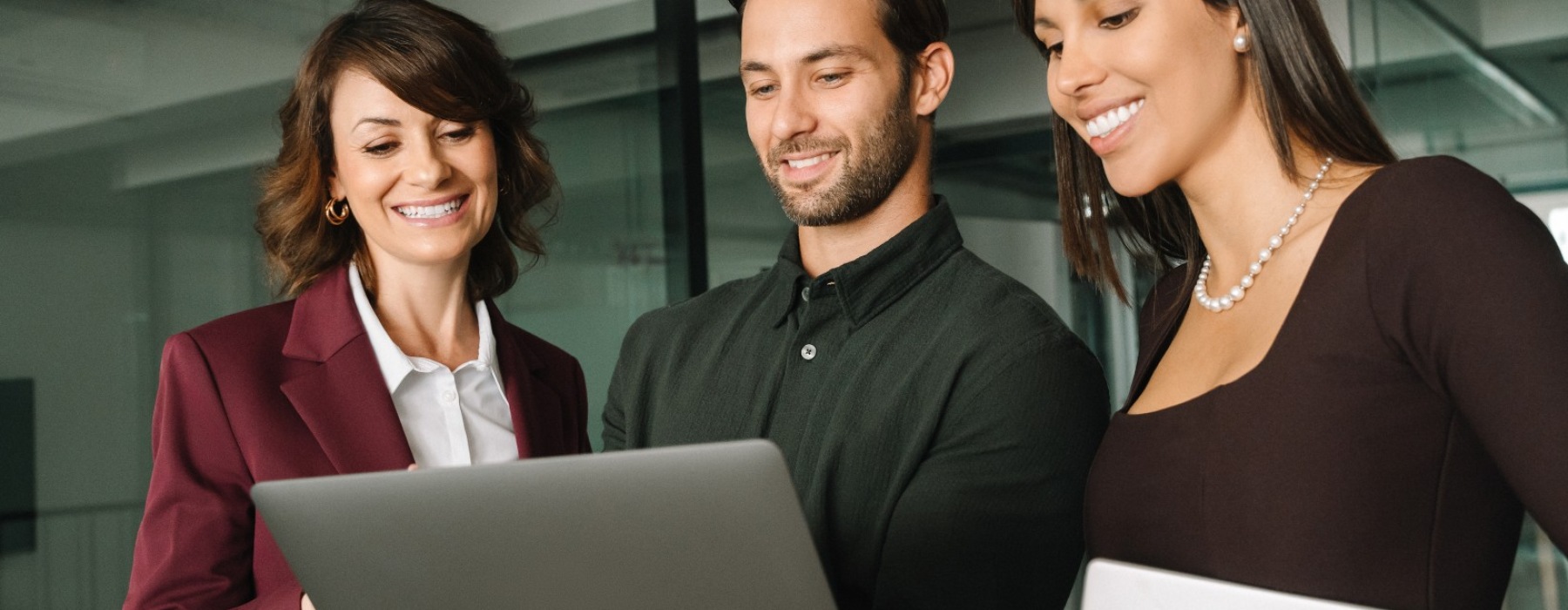 a group of people at a computer
