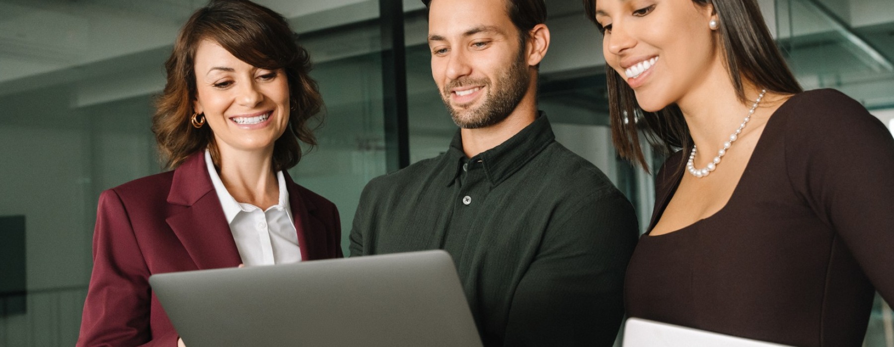 a group of people at a computer