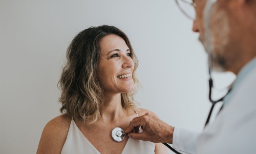 doctor listening to patient's heart