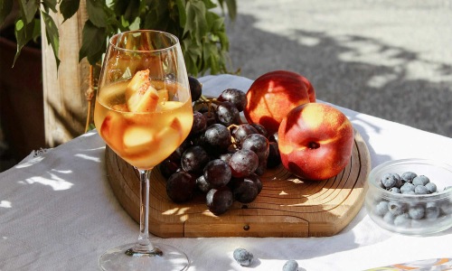 wine and fruit on an outdoor table